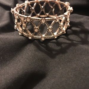 Silver tone shinny bracket with rhinestones